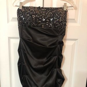 Knee length satin dress with sequin top.